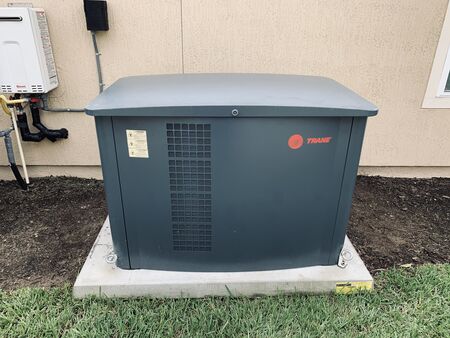 Satisfied Oakatie, SC, homeowner with their new standby generator installed by GenCo Generator, ensuring uninterrupted power