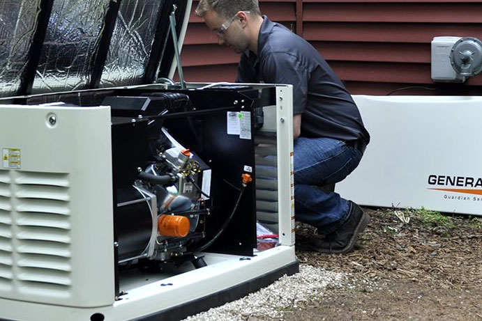 Skilled technician from GenCo Georgia performing routine maintenance on a standby generator in Kingsland, Georgia, for optimal performance